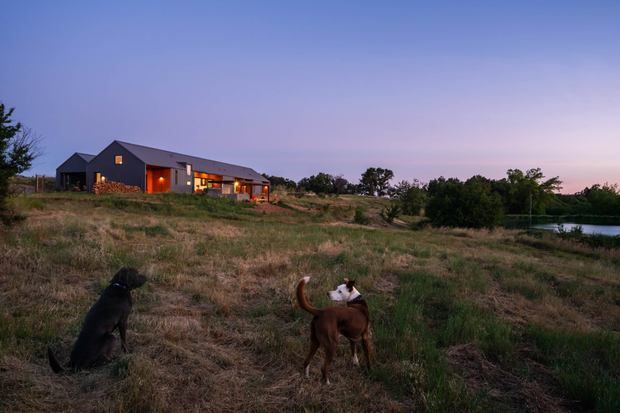 JNT custom home back view with pond