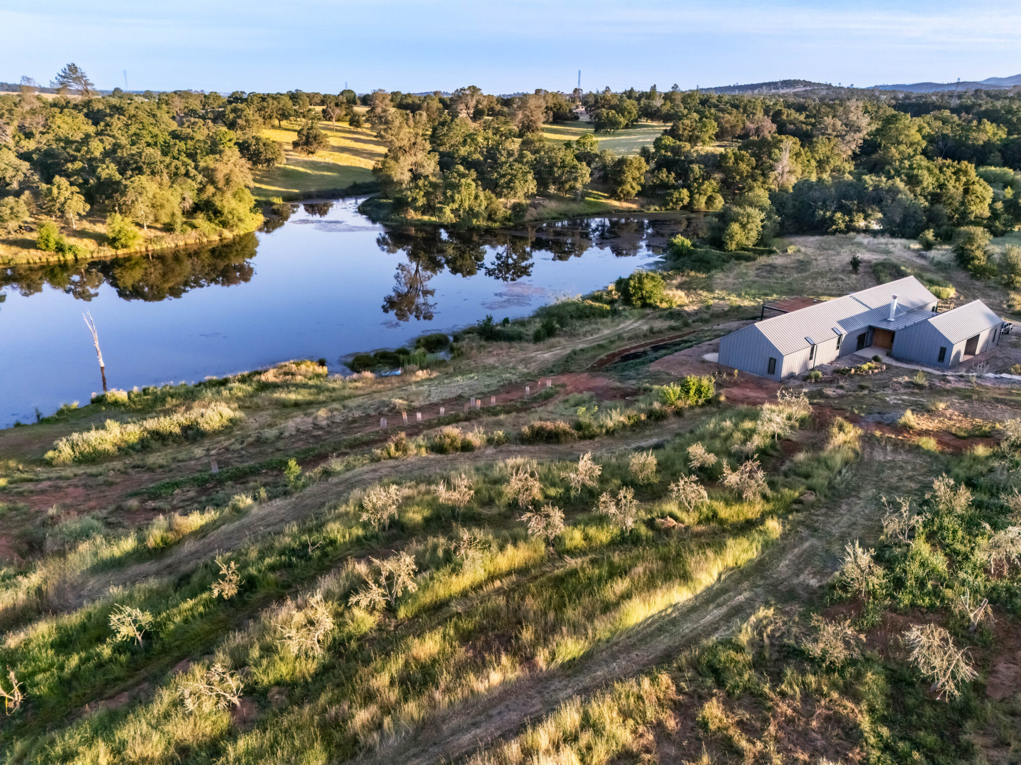 JNT custom home-drone view of house and land